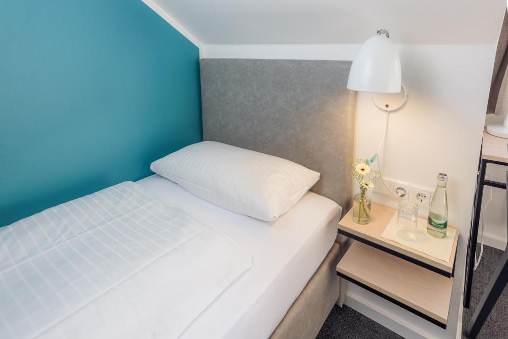 Postel nebo postele na pokoji v ubytování Hotel & Restaurant Mühlenglück
