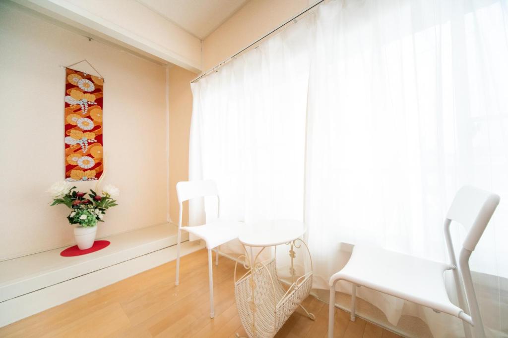 Posezení v ubytování Yokkaichi Nishishinchi Hotel