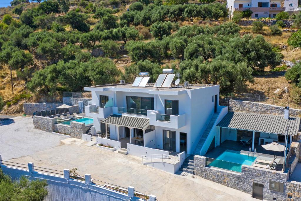 an aerial view of a villa with a swimming pool at Petasos in Plakias