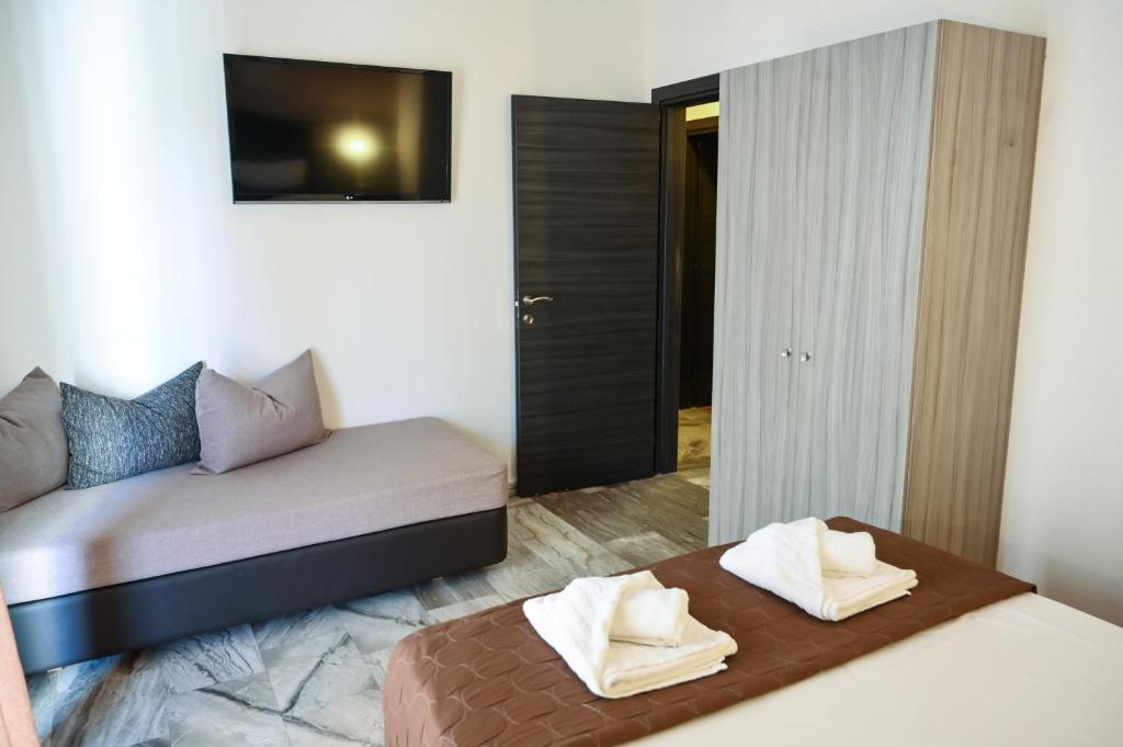 Posteľ alebo postele v izbe v ubytovaní Hotel Kostas