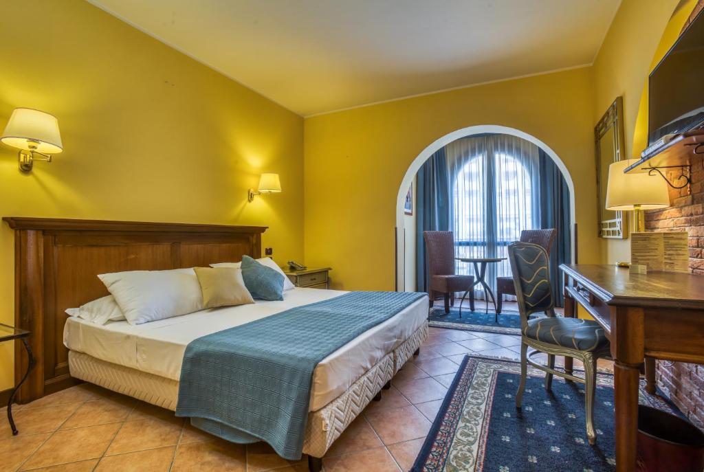 Postel nebo postele na pokoji v ubytování Hotel San Giorgio