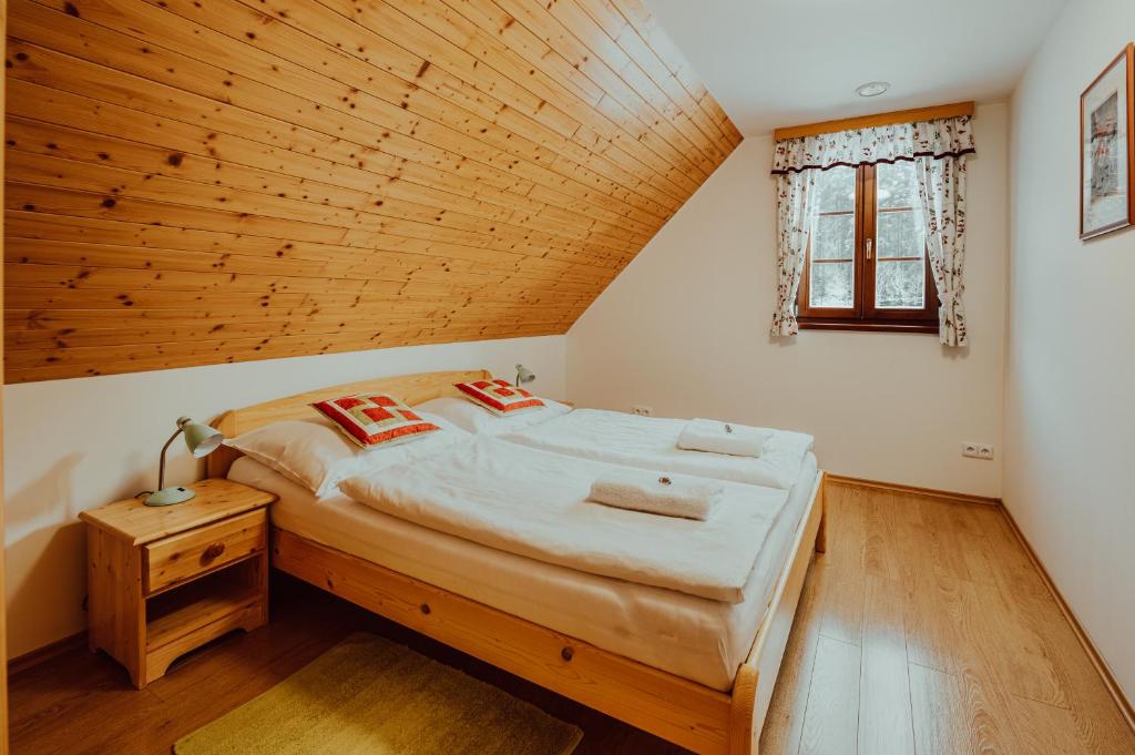 Postel nebo postele na pokoji v ubytování Valašský dvůr