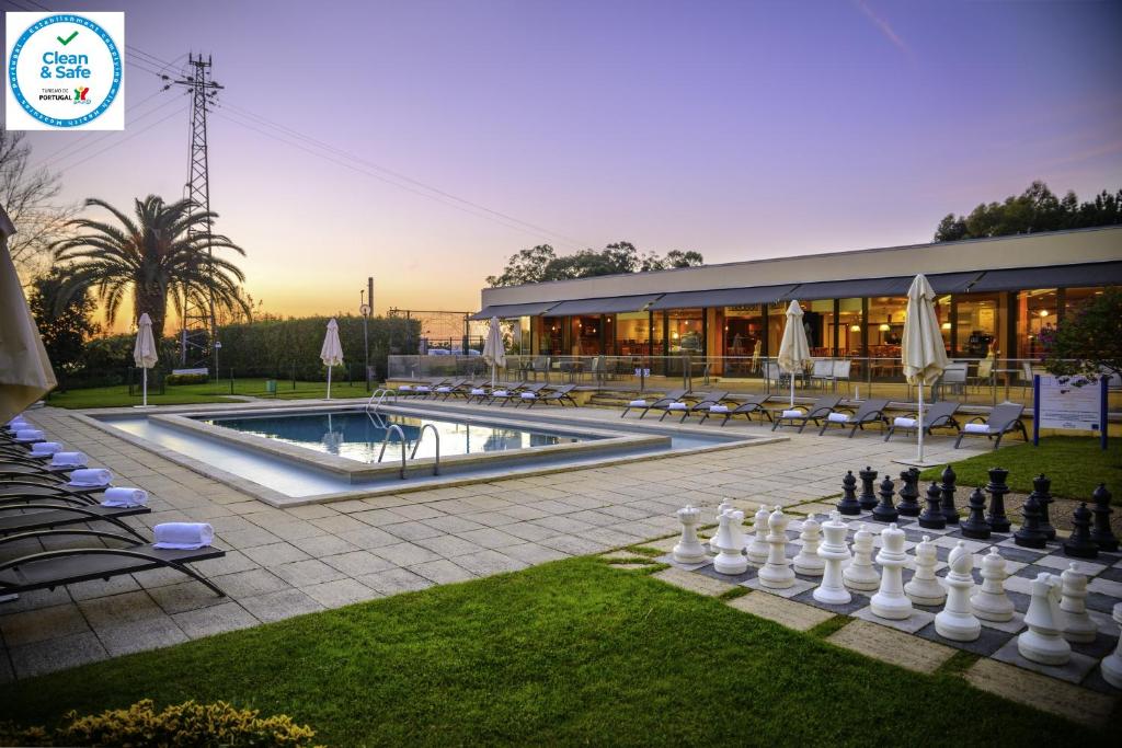 a large chess board in front of a building at Novotel Porto Gaia in Vila Nova de Gaia