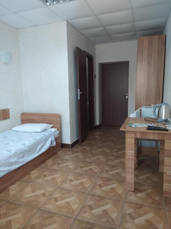 Postel nebo postele na pokoji v ubytování Zelenyi Kampus