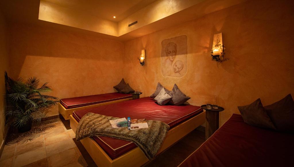 Postel nebo postele na pokoji v ubytování Hotel Der Schmittenhof