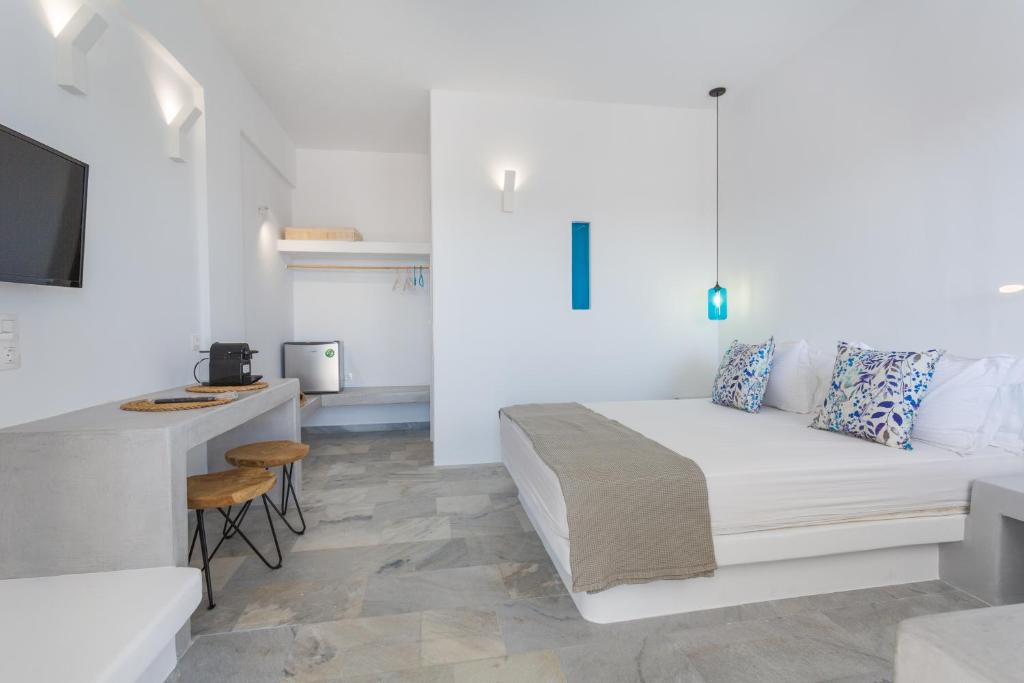 Postel nebo postele na pokoji v ubytování Aspries Suites
