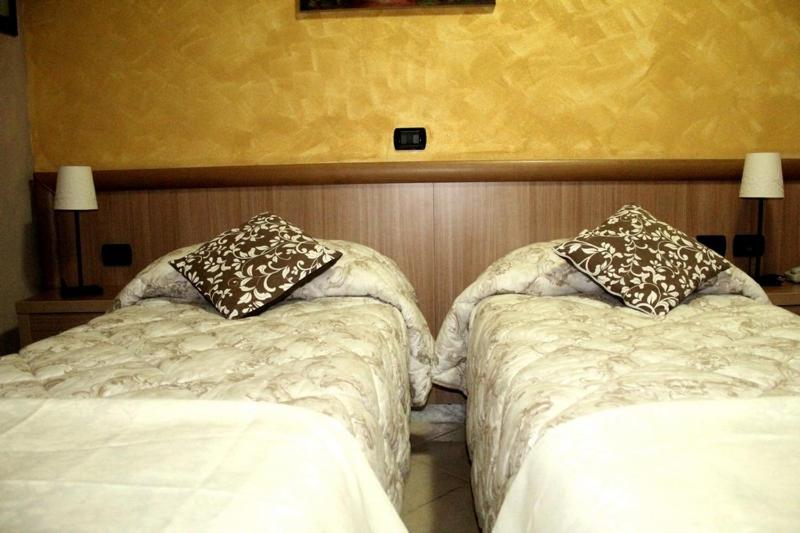 Postel nebo postele na pokoji v ubytování Albergo Posta
