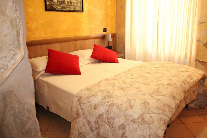 Postel nebo postele na pokoji v ubytování Albergo Posta