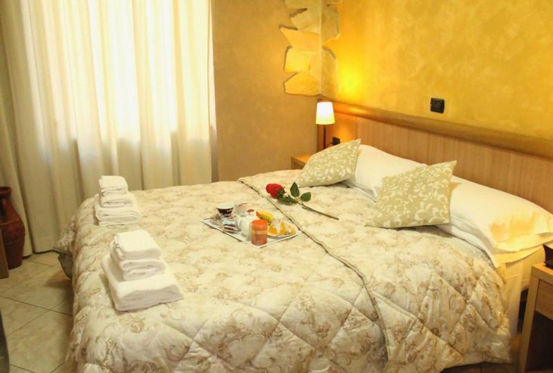 Postel nebo postele na pokoji v ubytování Albergo Posta