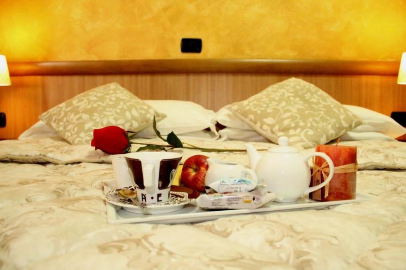 Postel nebo postele na pokoji v ubytování Albergo Posta