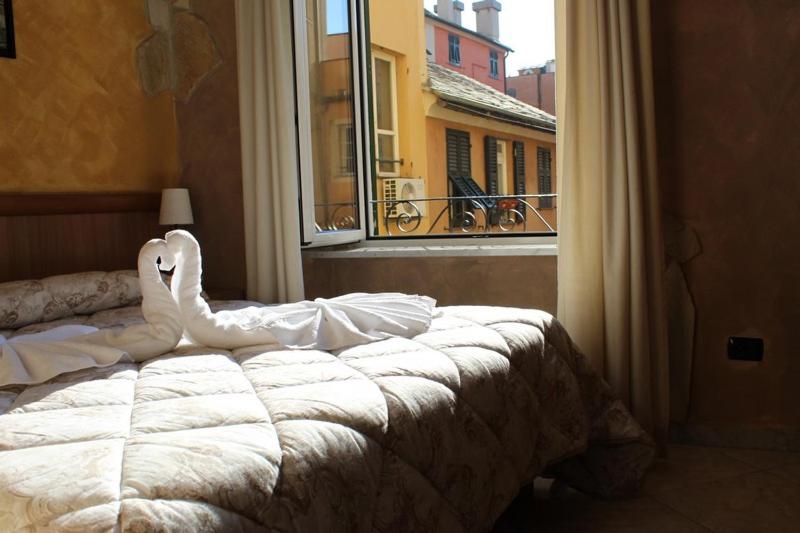 Postel nebo postele na pokoji v ubytování Albergo Posta