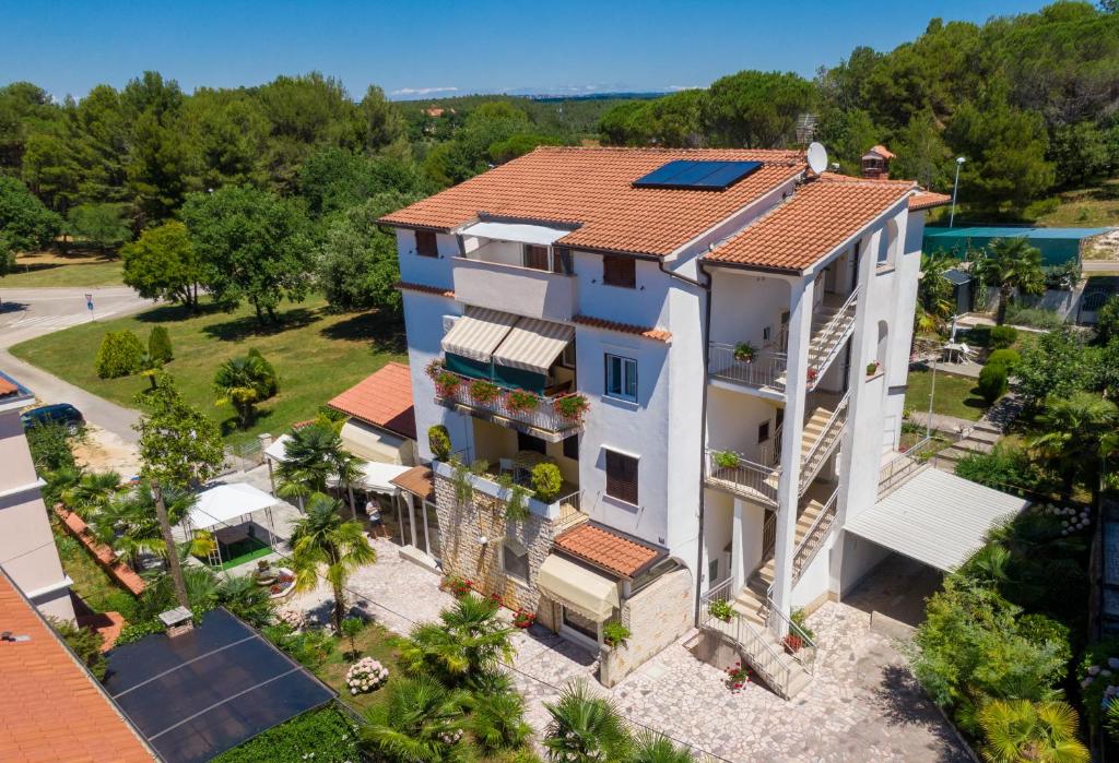 an aerial view of a house with a roof at Apartments Lori in Poreč