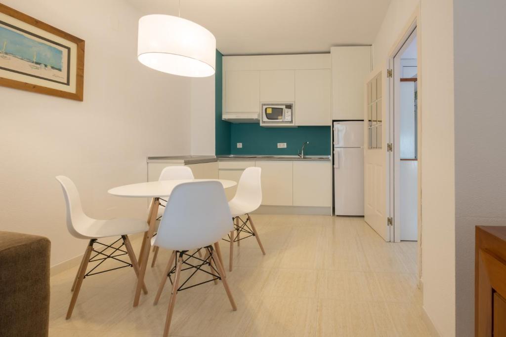 A kitchen or kitchenette at Aparthotel las Dunas