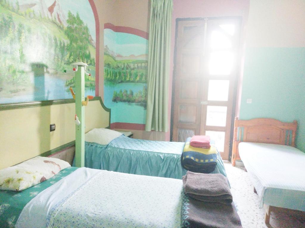 Cama o camas de una habitación en Hôtel Marrakech