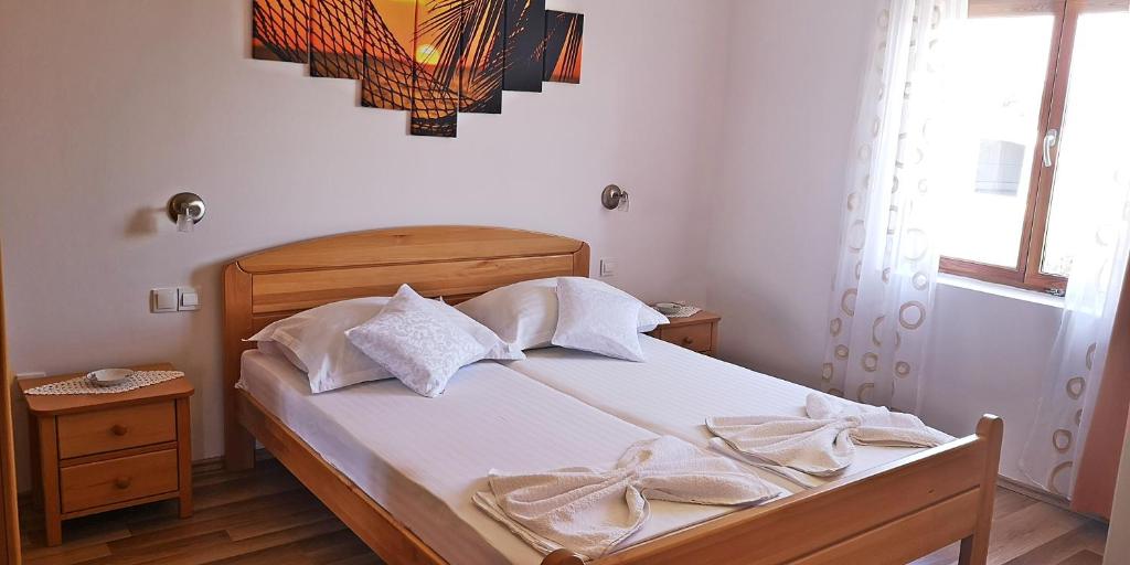 Łóżko lub łóżka w pokoju w obiekcie Apartments Bošković