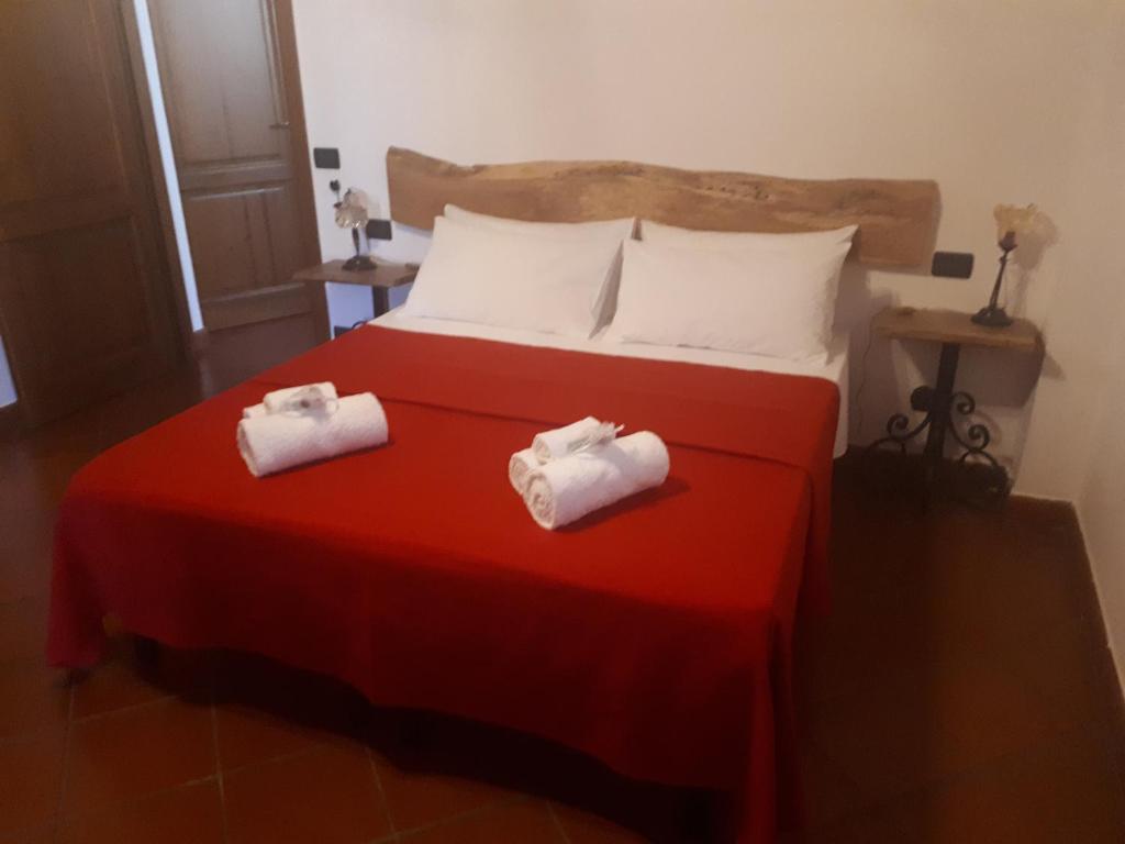 Postel nebo postele na pokoji v ubytování B&B I Pini Di Storaco