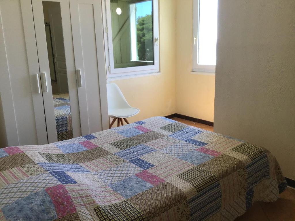 Postel nebo postele na pokoji v ubytování L'ilot Fleuri