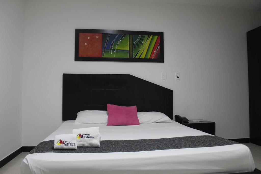 Postel nebo postele na pokoji v ubytování Hotel Cafeira