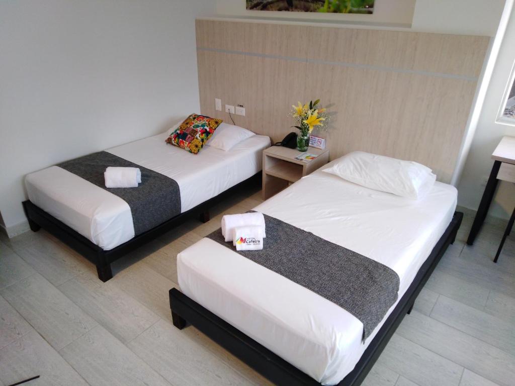 Postel nebo postele na pokoji v ubytování Hotel Cafeira