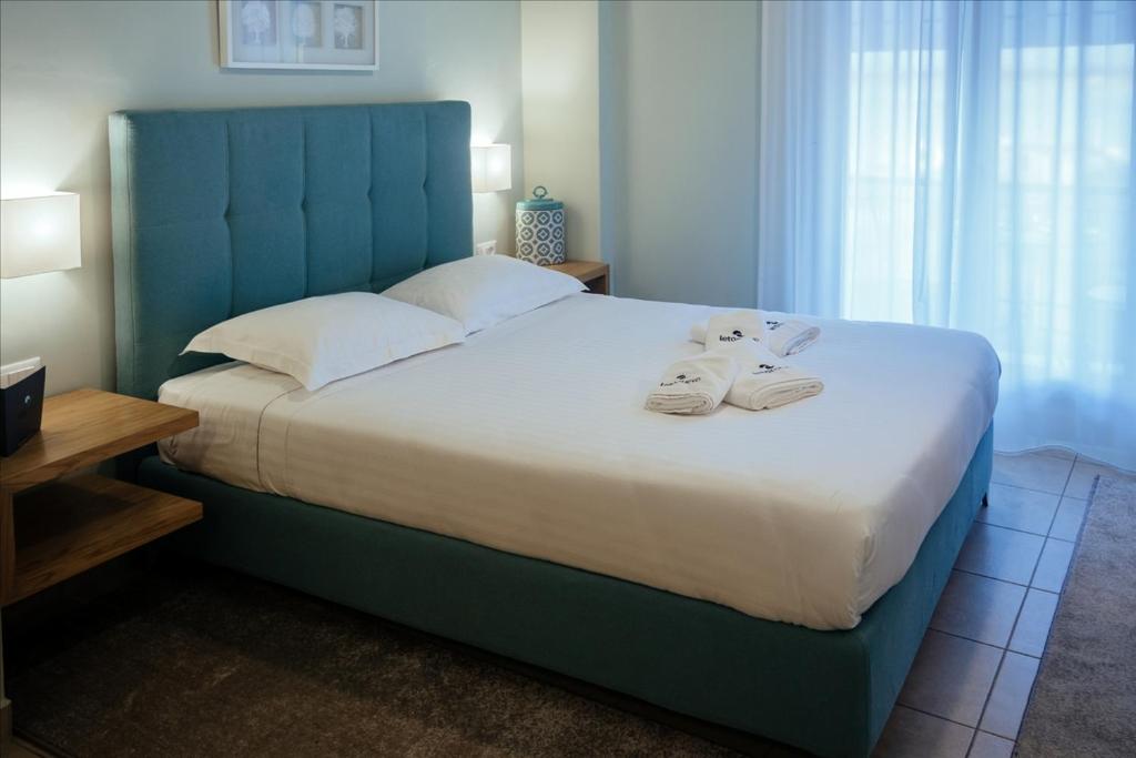 Postel nebo postele na pokoji v ubytování Leto Nuevo Hotel