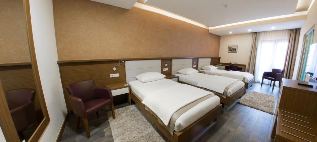 Postel nebo postele na pokoji v ubytování Hotel Mostar