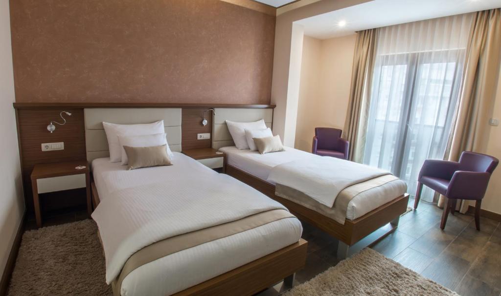 Postel nebo postele na pokoji v ubytování Hotel Mostar
