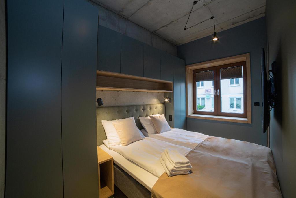 Postel nebo postele na pokoji v ubytování Home Again Apartments Kirkegata