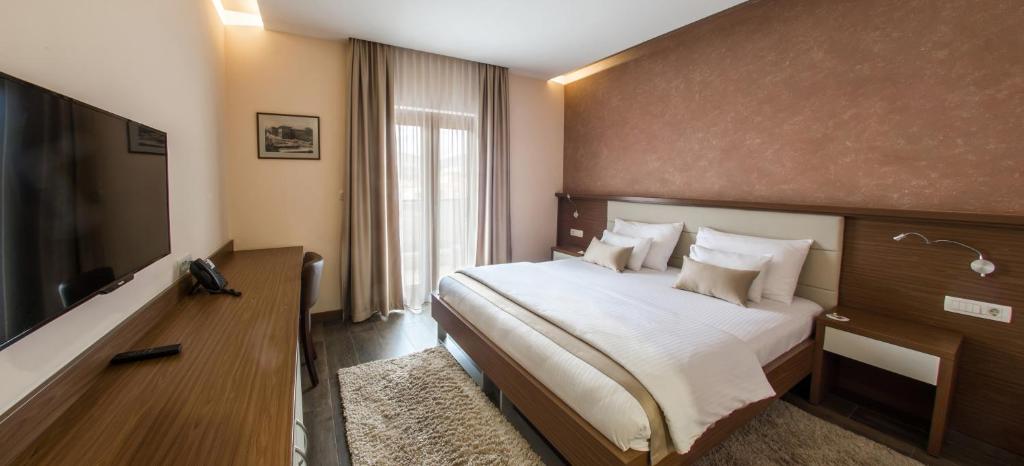 Postel nebo postele na pokoji v ubytování Hotel Mostar