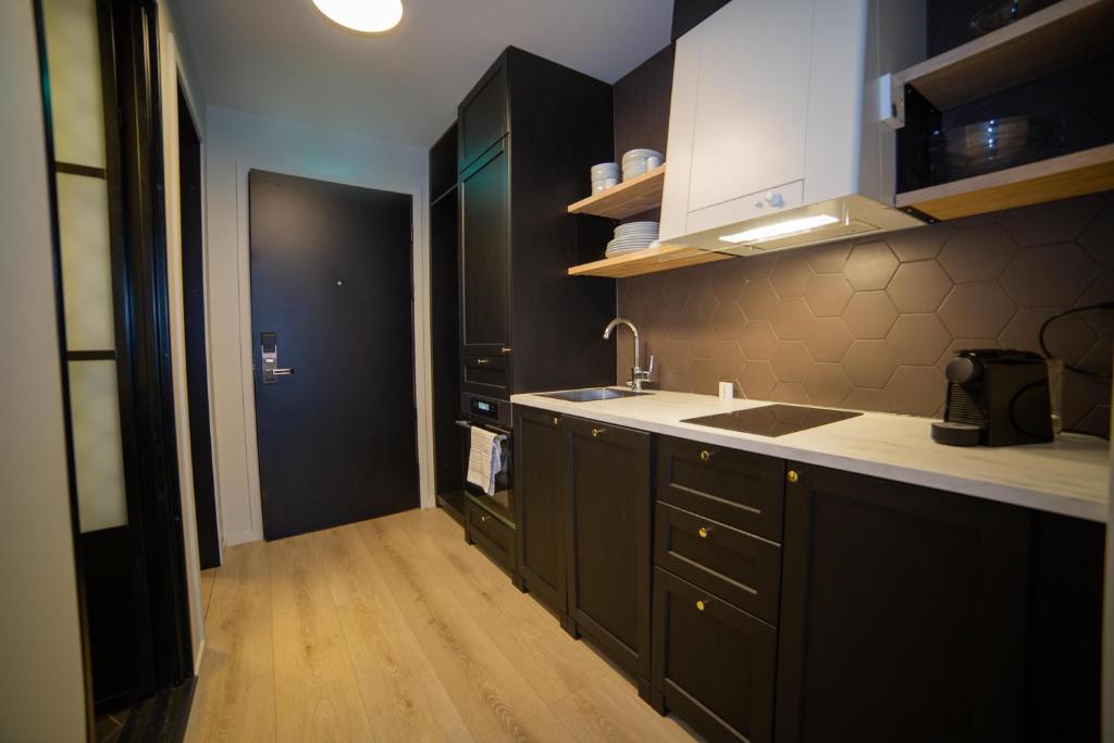 Kuchyň nebo kuchyňský kout v ubytování Home Again Apartments Kirkegata