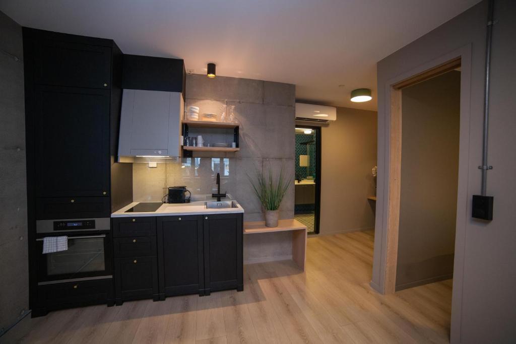 Kuchyň nebo kuchyňský kout v ubytování Home Again Apartments Kirkegata