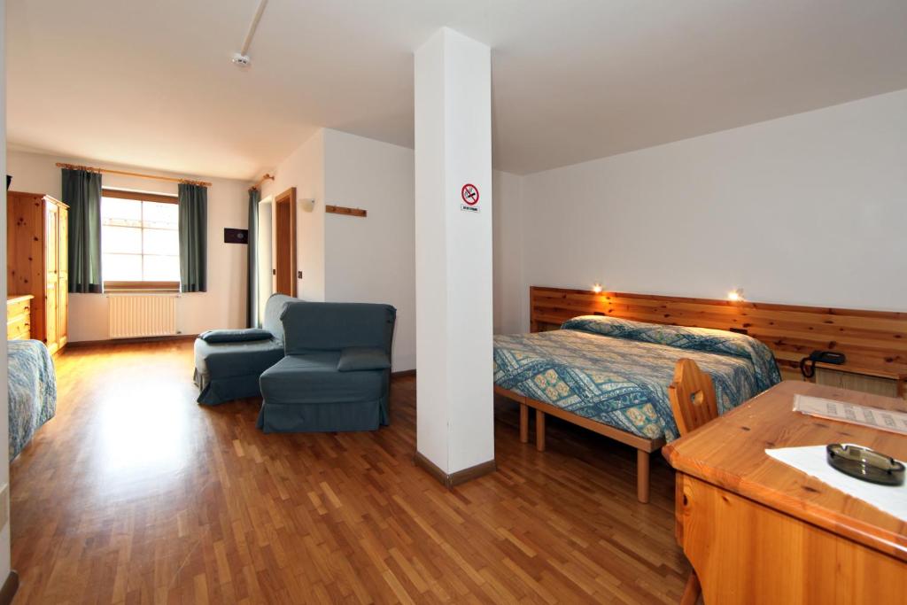 Postel nebo postele na pokoji v ubytování Garni Manuela