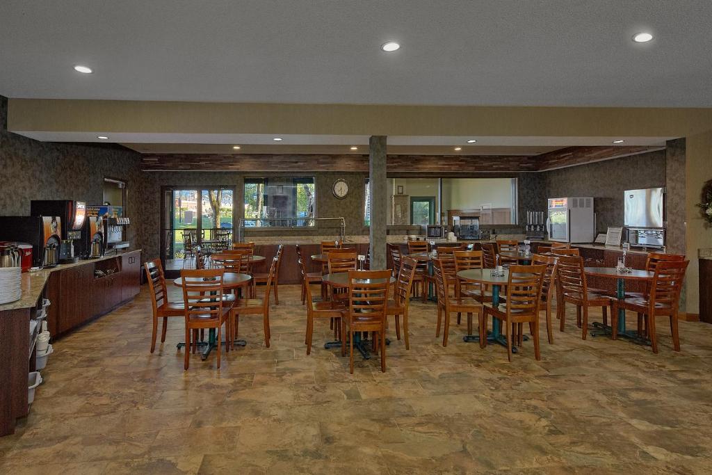 a dining room with wooden tables and chairs at The Inn On The River in Pigeon Forge
