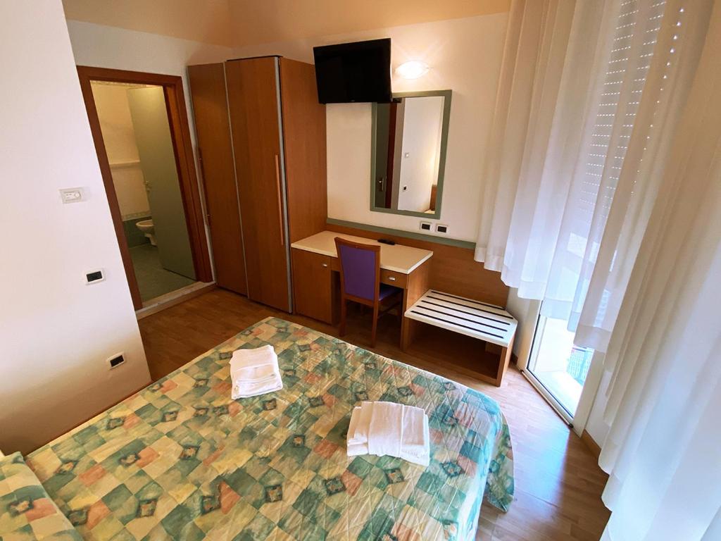 Postel nebo postele na pokoji v ubytování Hotel Diplomatic