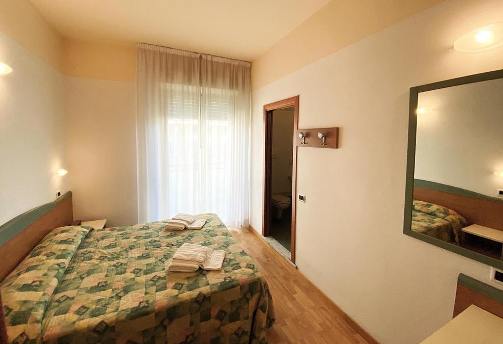Postel nebo postele na pokoji v ubytování Hotel Diplomatic