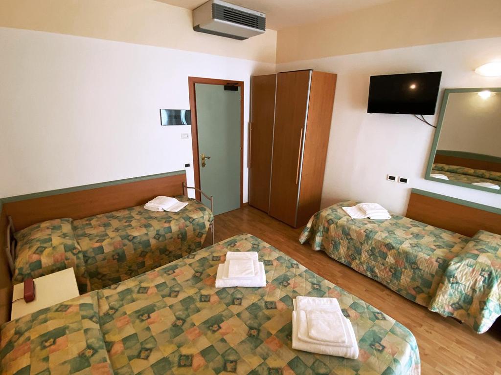 Postel nebo postele na pokoji v ubytování Hotel Diplomatic