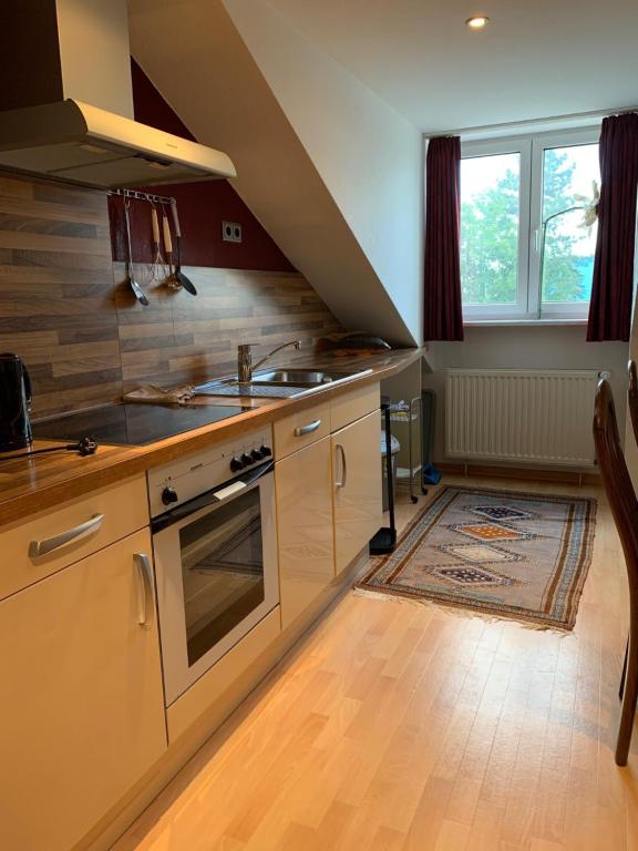 Kuchyň nebo kuchyňský kout v ubytování Stadthotel Geis