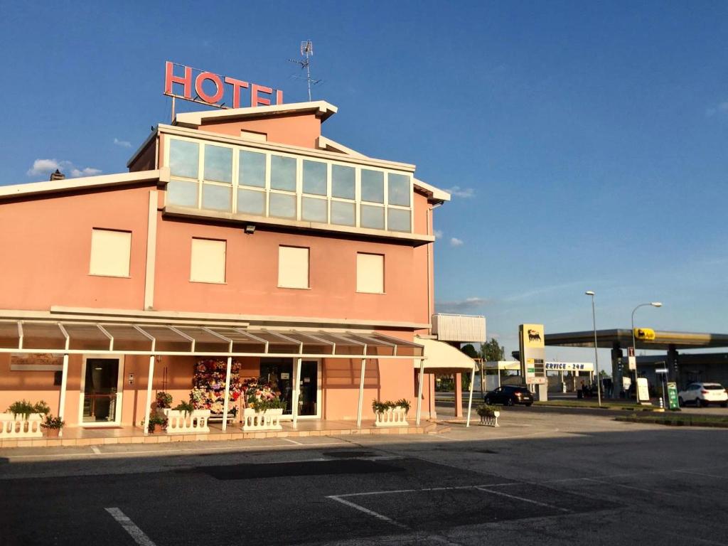 a building with a hotel sign on top of it at Hotel Trieste in San Giórgio di Nogaro