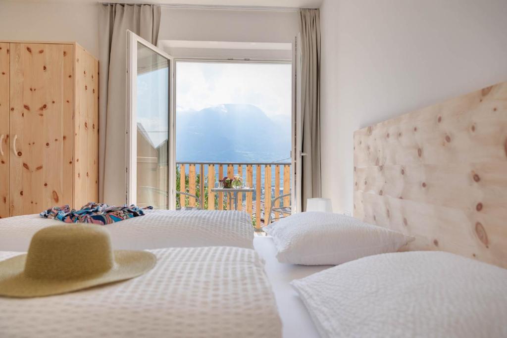 Postel nebo postele na pokoji v ubytování MeranoView Apartments