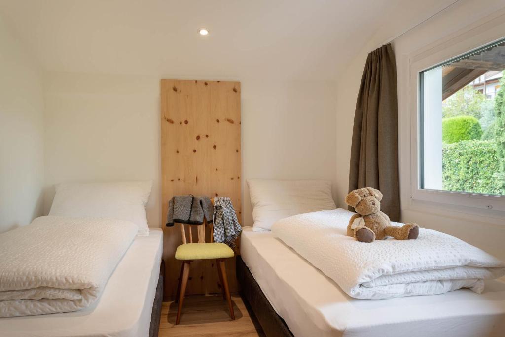 Postel nebo postele na pokoji v ubytování MeranoView Apartments