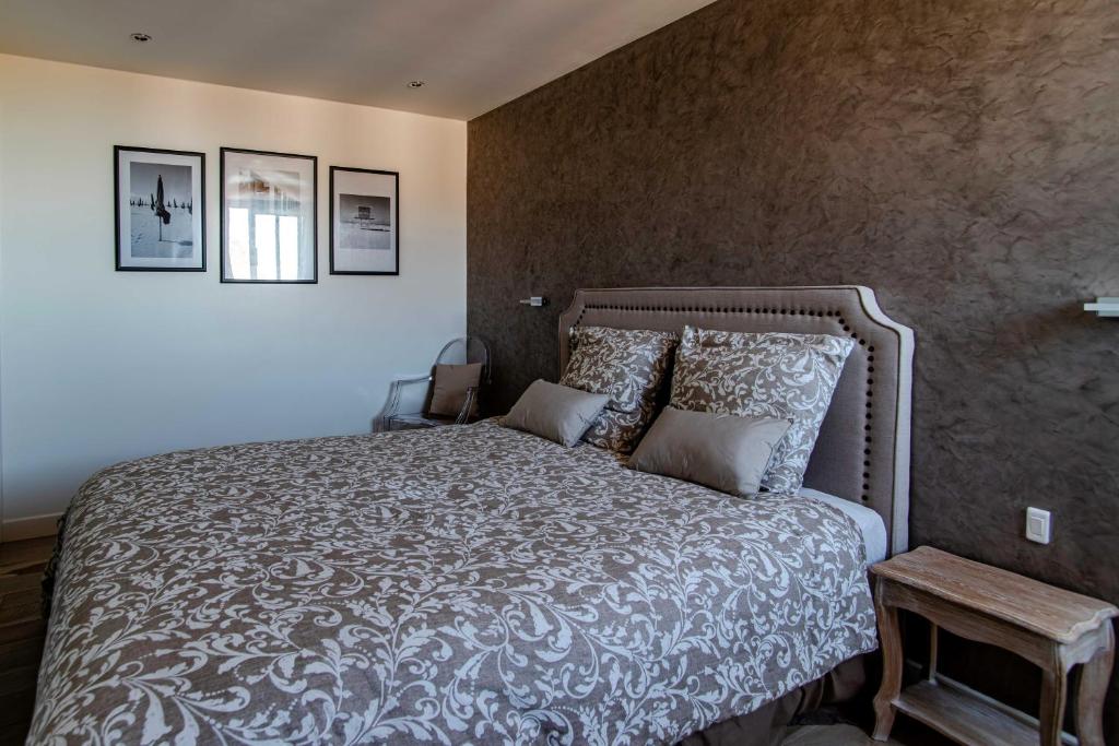 מיטה או מיטות בחדר ב-Le Deauvilla - Duplex Penthouse vue mer Deauville