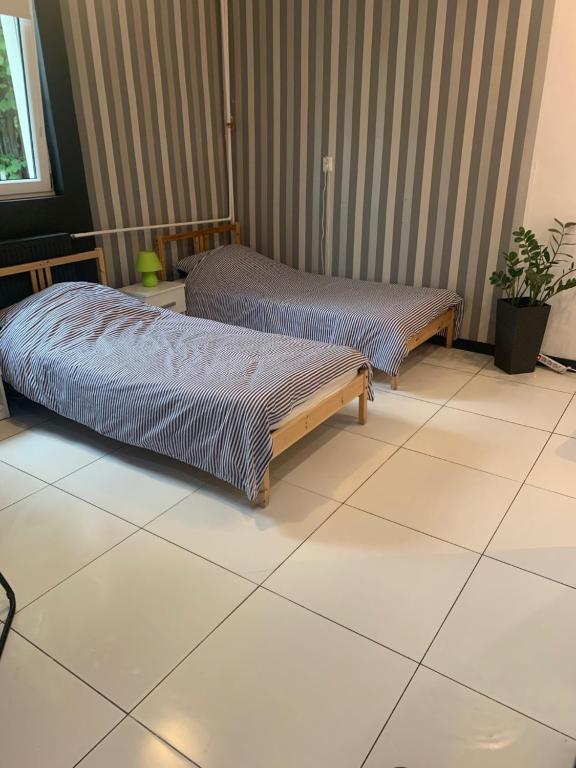 Postel nebo postele na pokoji v ubytování Smart Stay Hostel Gdynia