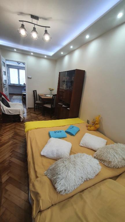 Łóżko lub łóżka w pokoju w obiekcie Apartament Park Saski