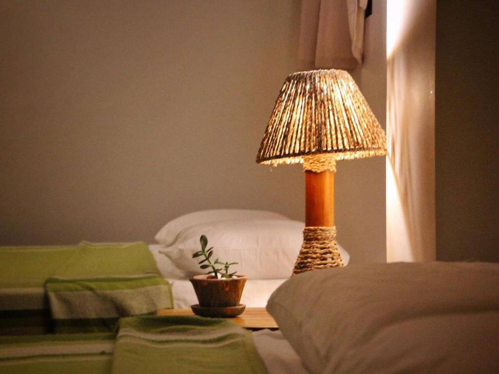 Postel nebo postele na pokoji v ubytování Seaside Garden Ecolodge Mompiche