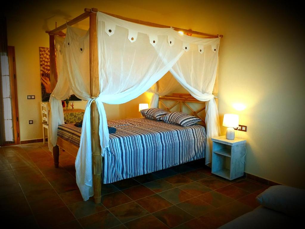 เตียงในห้องที่ Agriturismo El Bounty