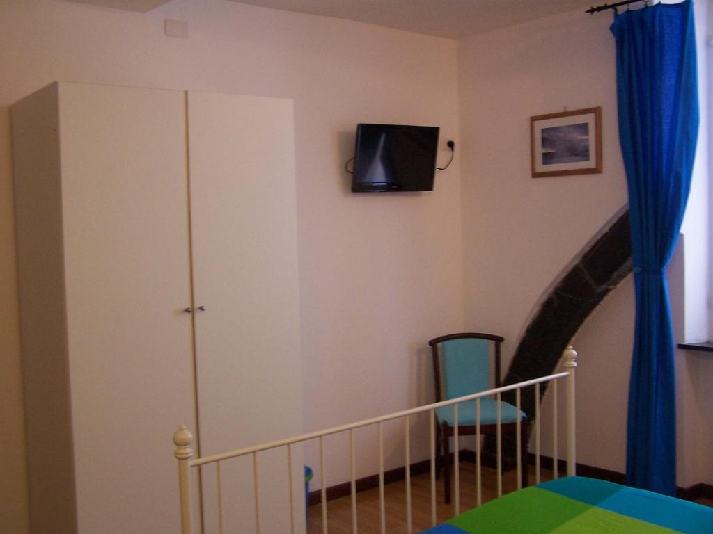 TV a/nebo společenská místnost v ubytování B&B Archi di Borgolungo