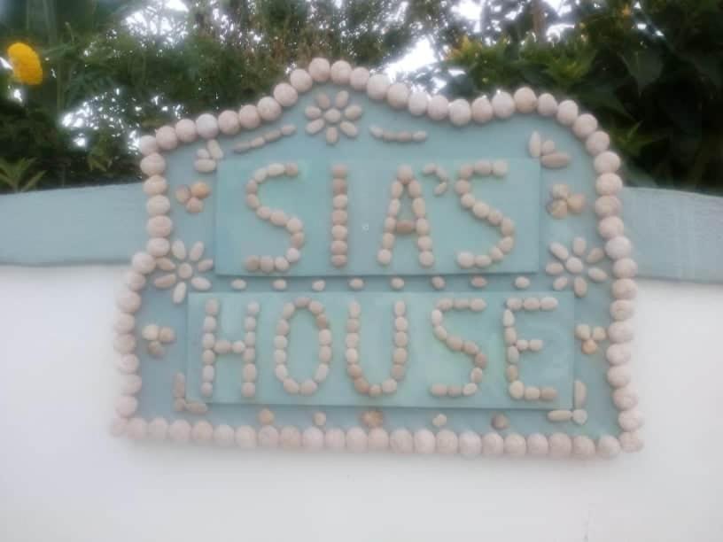 a blue sign with a sign for a hospital at SIAS HOUSE in Lixouri