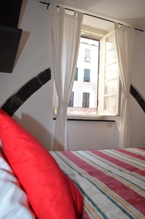 Postel nebo postele na pokoji v ubytování B&B Archi di Borgolungo