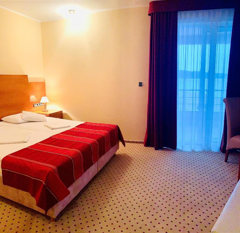 Postel nebo postele na pokoji v ubytování Hotel Duje