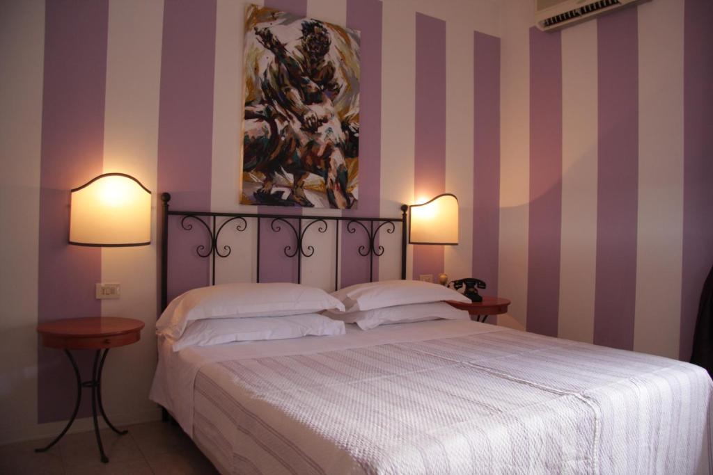 Postel nebo postele na pokoji v ubytování Hotel Alex