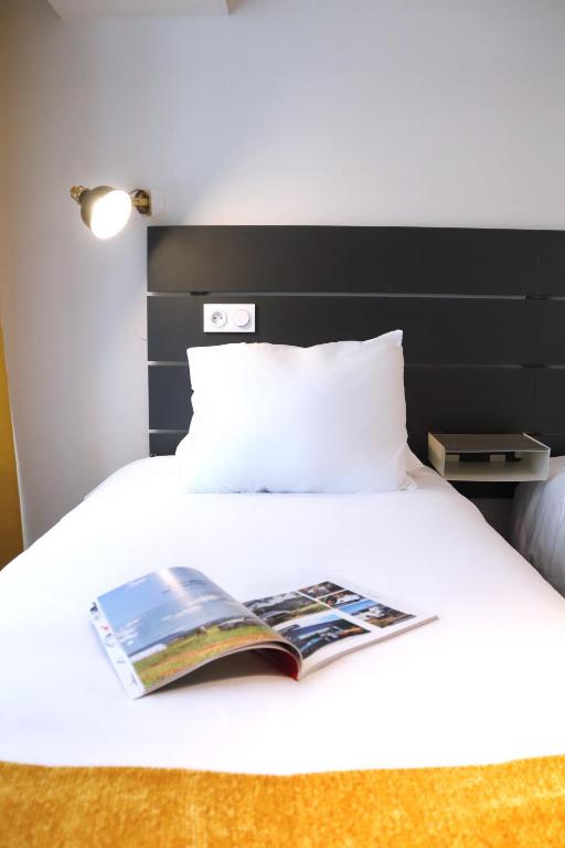 Postel nebo postele na pokoji v ubytování Hotel Athanor Centre